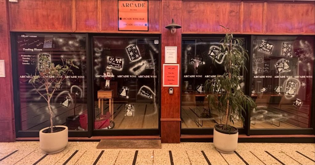 In front of Arcade Wine